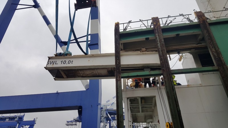 Crane lift over containers